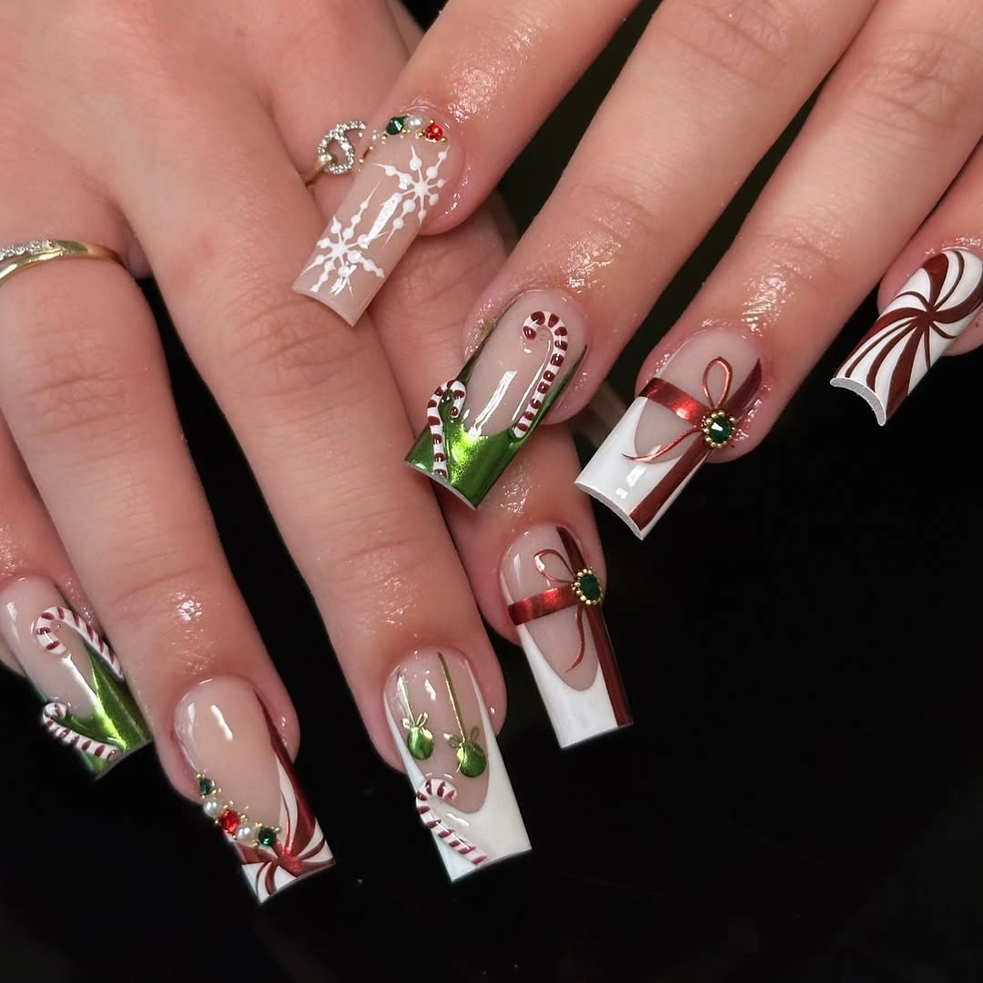 Long coffin nails with white tips, candy canes, red bows, and green accents.